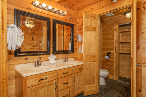 Bathroom with two sinks at Smokies Paradise Lodge, a 5 bedroom cabin rental located in Pigeon Forge