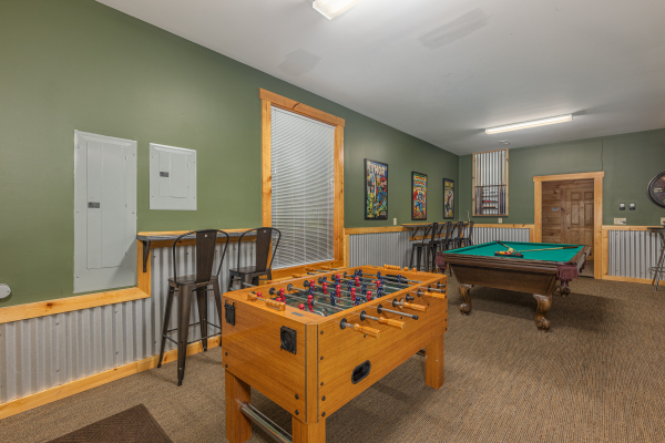Foosball table at Smokies Paradise Lodge, a 5 bedroom cabin rental located in Pigeon Forge