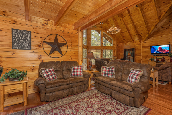 Two loveseats in the foyer at Smokies Paradise Lodge, a 5 bedroom cabin rental located in Pigeon Forge