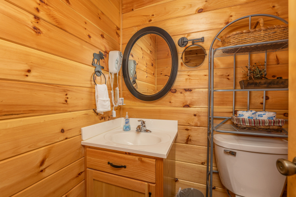 Half bath at Smokies Paradise Lodge, a 5 bedroom cabin rental located in Pigeon Forge