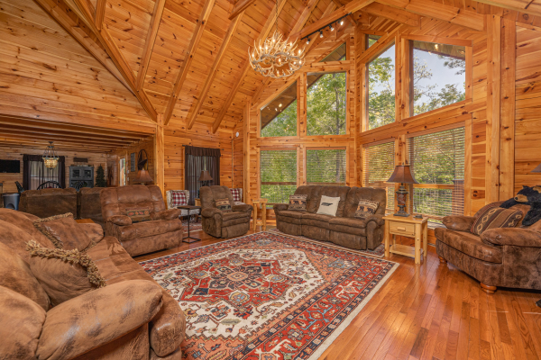 Chairs and sofa in the living room at Smokies Paradise Lodge, a 5 bedroom cabin rental located in Pigeon Forge