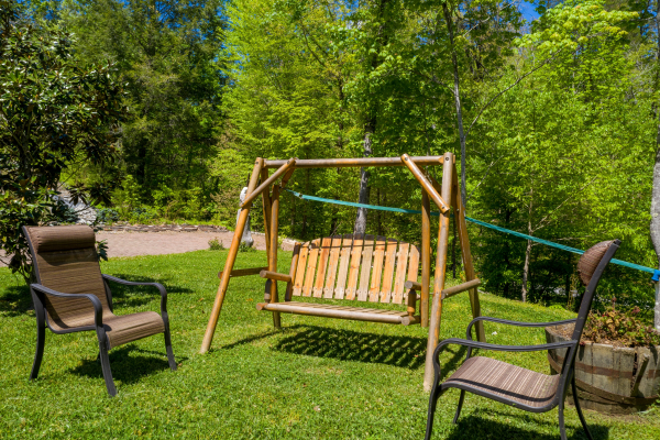 Swing in the yard at Smokies Paradise Lodge, a 5 bedroom cabin rental located in Pigeon Forge