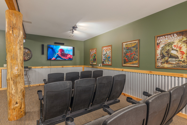 Theater room with movie seats at Smokies Paradise Lodge, a 5 bedroom cabin rental located in Pigeon Forge