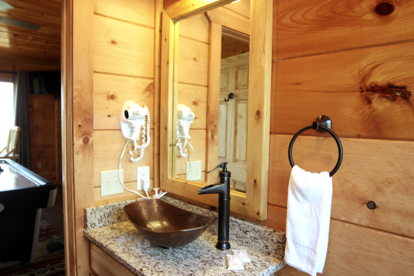 Custom sink in the half bath at Makin' Honey, a 1 bedroom cabin rental located in Pigeon Forge