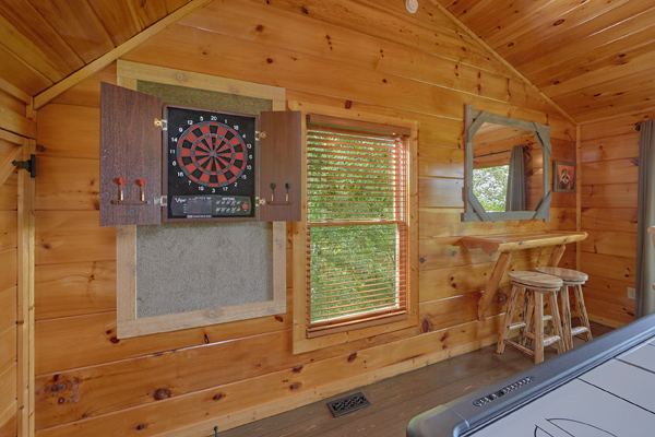 Electronic dart board in the game loft at Makin' Honey, a 1 bedroom cabin rental located in Pigeon Forge