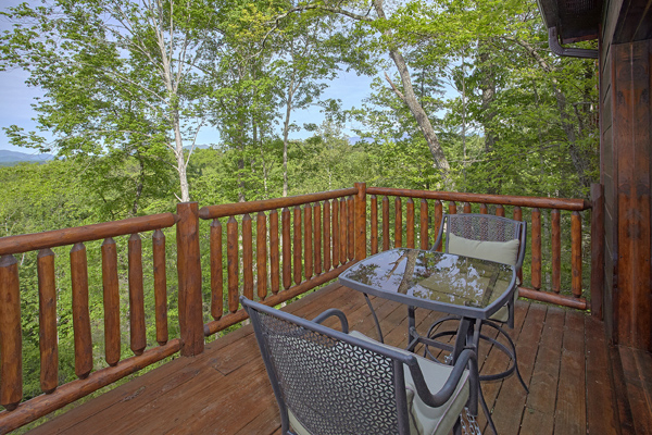 Deck dining for two at Makin' Honey, a 1 bedroom cabin rental located in Pigeon Forge