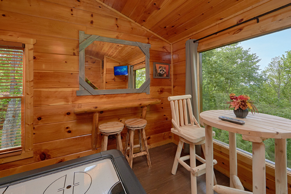 Seating in the game loft at Makin' Honey, a 1 bedroom cabin rental located in Pigeon Forge