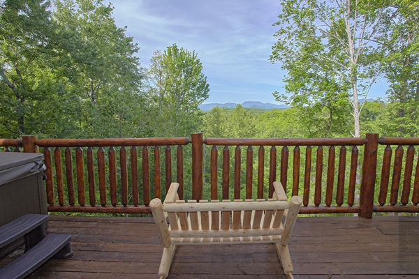 Oversized rocker looking at the mountains at Makin' Honey, a 1 bedroom cabin rental located in Pigeon Forge