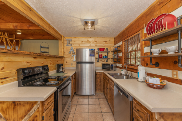 Kitchen with stainless appliances at Wild at Heart, a 1 bedroom cabin rental located in Gatlinburg