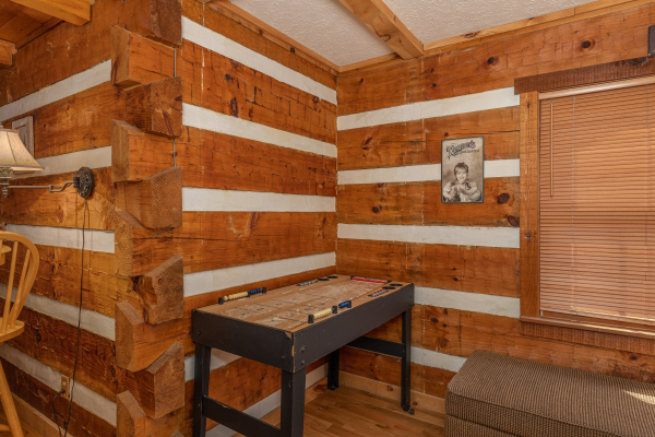 Shuffleboard game at Wild at Heart, a 1 bedroom cabin rental located in Gatlinburg