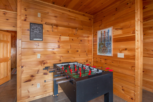Foosball table at Ella-Vation, a 3 bedroom cabin rental located in Gatlinburg