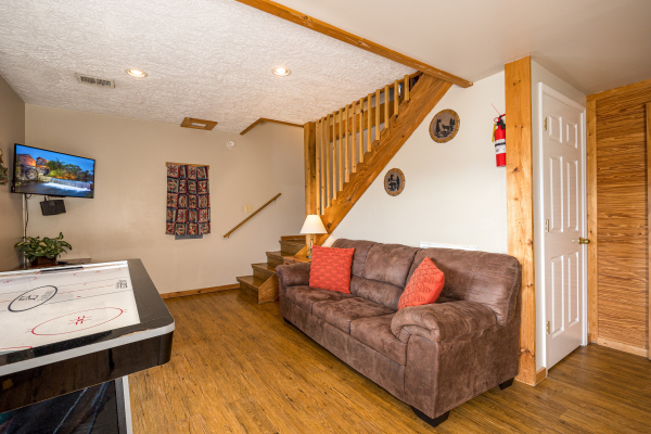 Seating by staircase at Brink of Heaven, a 2 bedroom cabin rental located in Gatlinburg