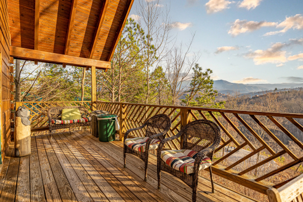 Seating for two on the deck at Brink of Heaven, a 2 bedroom cabin rental located in Gatlinburg