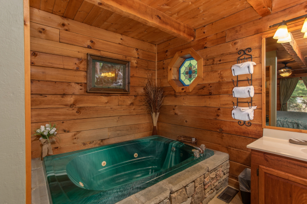 Jacuzzi tub on the main floor at Golden Memories, a 1-bedroom cabin rental located in Pigeon Forge