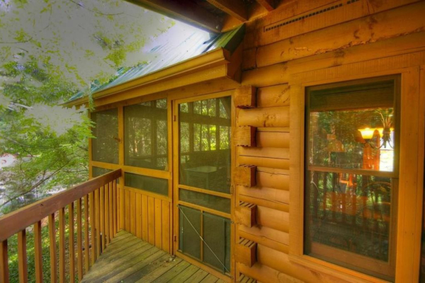 Access to the screened porch from the deck at Golden Memories, a 1-bedroom cabin rental located in Pigeon Forge