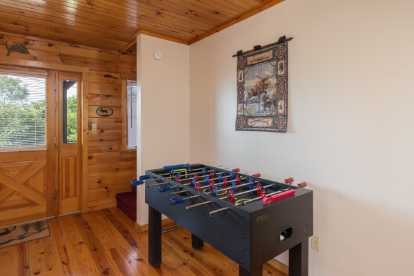 Foosball table at Moose Lodge, a 4 bedroom cabin rental located in Sevierville