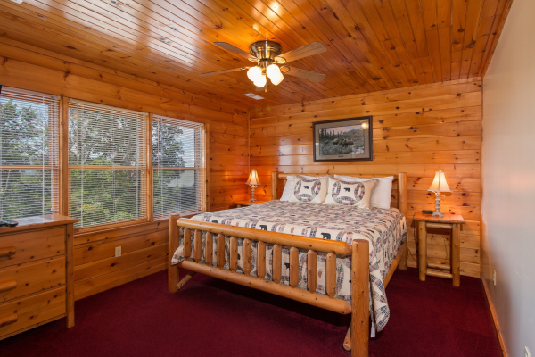 Bedroom with a log bed, night stands, and lamps at Moose Lodge, a 4 bedroom cabin rental located in Sevierville