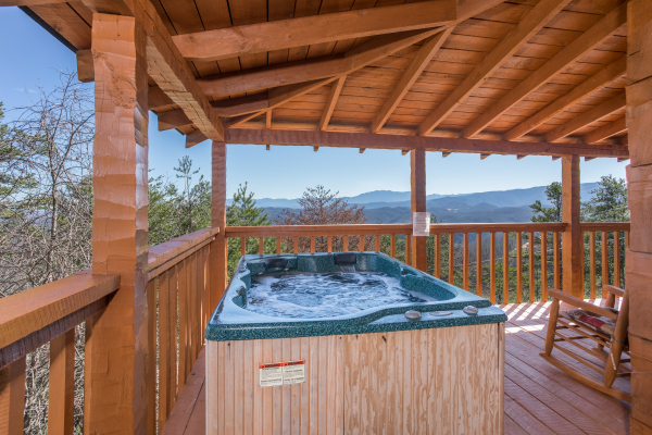 Hot tub on a covered deck at Mountain Glory, a 1 bedroom cabin rental located in Pigeon Forge