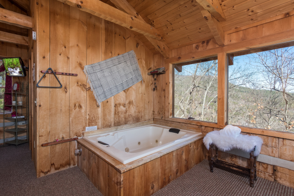 Jacuzzi in a bedroom at Mountain Glory, a 1 bedroom cabin rental located in Pigeon Forge