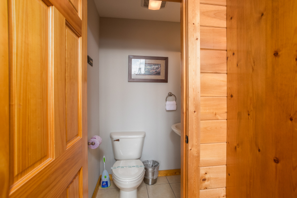Half bath on the main floor at Endless View, a 4 bedroom cabin rental located in Pigeon Forge