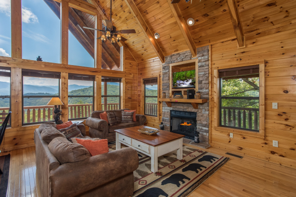 Living room with fireplace and TV at Endless View, a 4 bedroom cabin rental located in Pigeon Forge