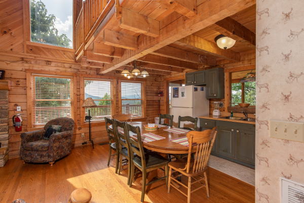 Dining table with seating for seven at Cabin in the Clouds, a 3-bedroom cabin rental located in Pigeon Forge