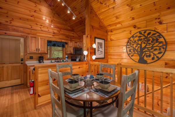 Dining table for four at Kelly's Cabin, a 1 bedroom cabin rental located in Pigeon Forge