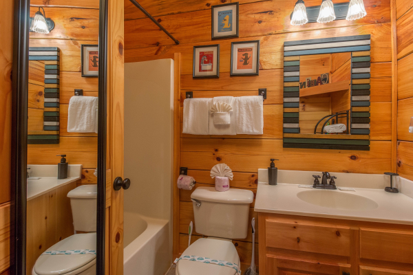 Bathroom with a tub and shower at Kelly's Cabin, a 1 bedroom cabin rental located in Pigeon Forge