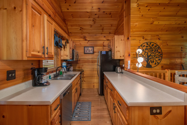 Galley kitchen at Kelly's Cabin, a 1 bedroom cabin rental located in Pigeon Forge