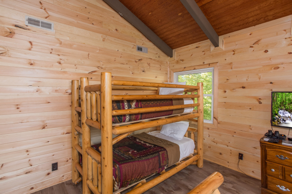 Bunk beds and TV in the loft at Forever Country, a 3 bedroom cabin rental located in Pigeon Forge