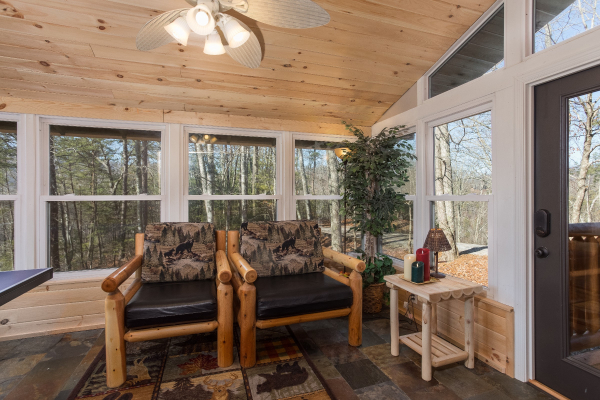 Log chairs at Forever Country, a 3 bedroom cabin rental located in Pigeon Forge