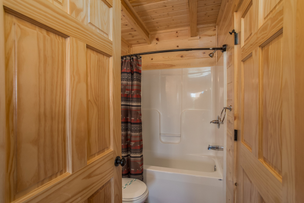 Bathroom with a tub and shower at The Sugar Shack, a 2 bedroom cabin rental located in Pigeon Forge