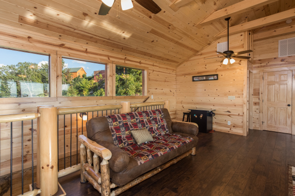 Futon in the loft at The Sugar Shack, a 2 bedroom cabin rental located in Pigeon Forge