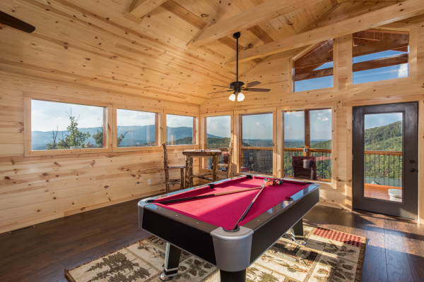 Pool table in the loft at The Sugar Shack, a 2 bedroom cabin rental located in Pigeon Forge