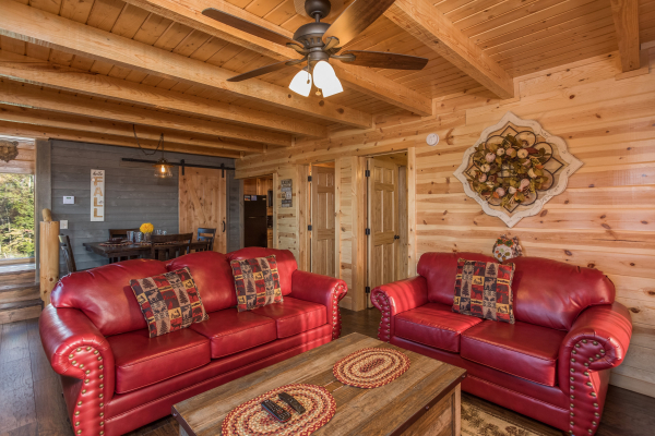 Living room with sofa and loveseat at The Sugar Shack, a 2 bedroom cabin rental located in Pigeon Forge