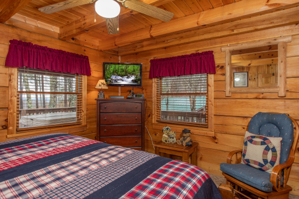 Dresser and TV in the main floor bedroom at Bearfoot Adventure, a Gatlinburg Cabin rental