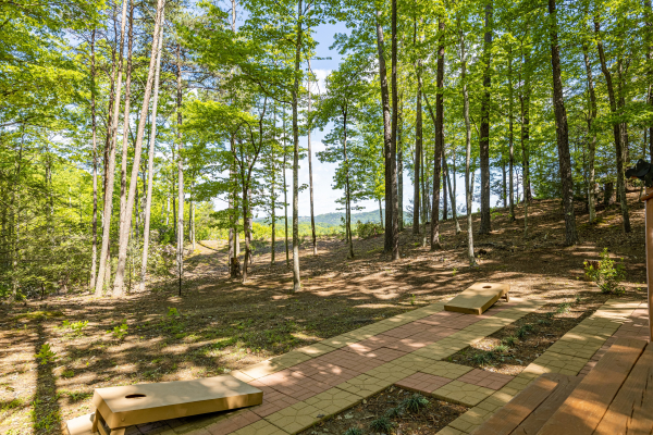 Patio with cornhole at Bearfoot Adventure, a 2 bedroom cabin rental located in Gatlinburg