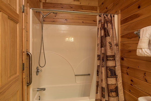 Bathroom with a tub and shower at Lake Life, a 4 bedroom cabin rental located in Sevierville