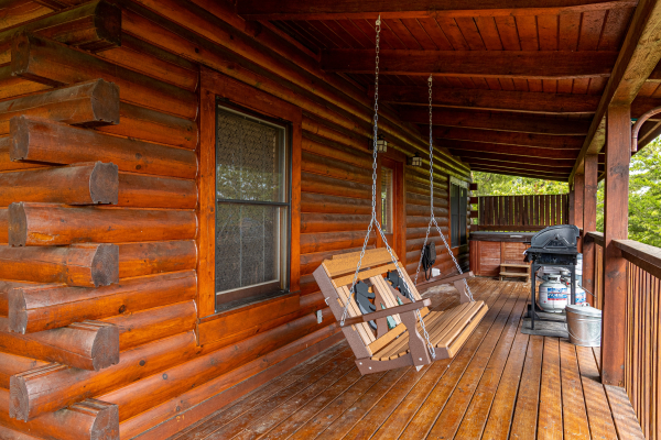 Porch swing at Eagle's Nest, a 2-bedroom cabin rental located in Sevierville