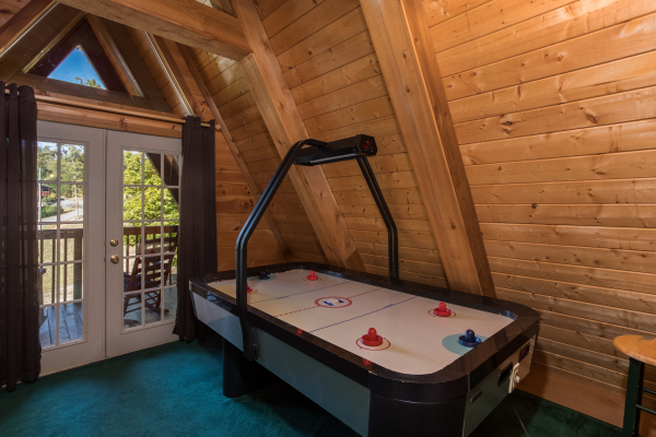 Air hockey table at Living on Love, a 2 bedroom cabin rental located in Pigeon Forge
