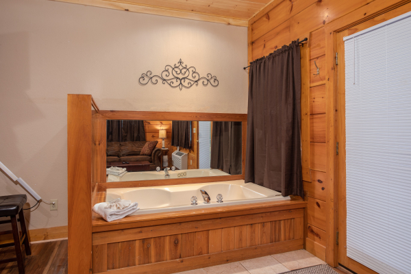 Jacuzzi in the lower living area at Starry Starry Night #725, a 2 bedroom cabin rental located in Pigeon Forge