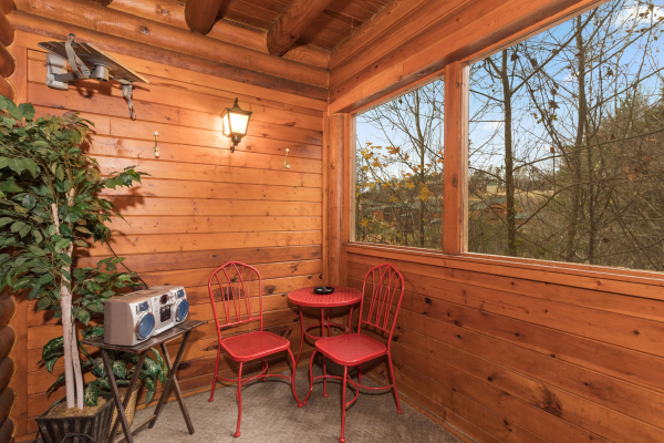 Screened porch at Starry Starry Night #725, a 2 bedroom cabin rental located in Pigeon Forge