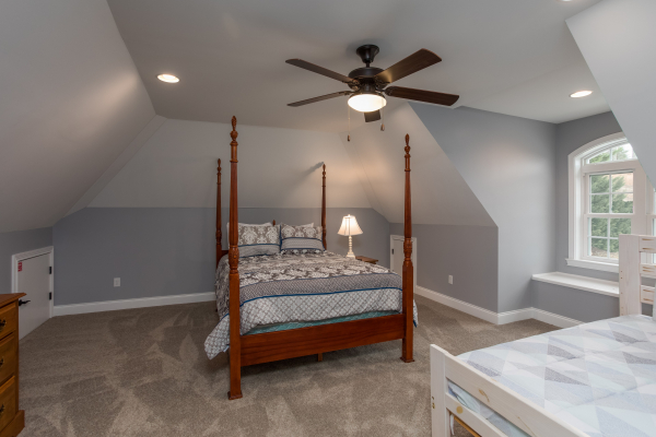 Bedroom with a four post bed at Summit Glory, a 5 bedroom cabin rental located in Pigeon Forge