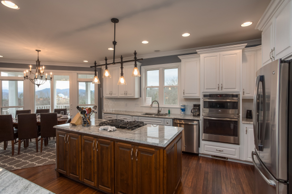 Island in a kitchen with stainless appliances at Summit Glory, a 5 bedroom cabin rental located in Pigeon Forge