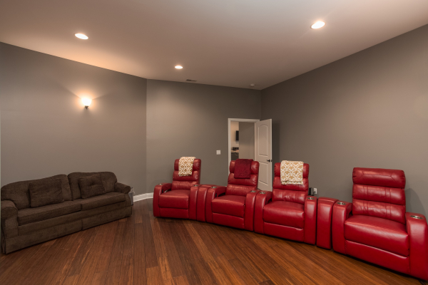 Seating in the theater room at Summit Glory, a 5 bedroom cabin rental located in Pigeon Forge