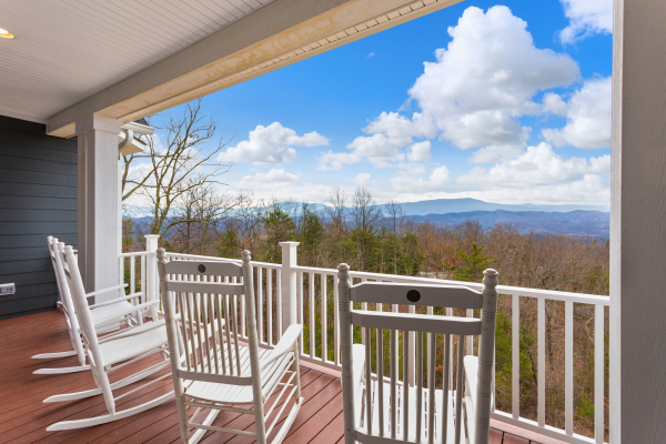 Rocking chairs on a deck at Summit Glory, a 5 bedroom cabin rental located in Pigeon Forge