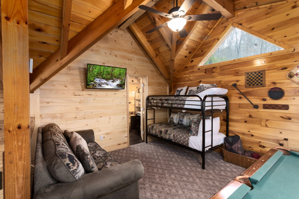 Bunk beds in the loft at Bootlegger's Bounty, a 1-bedroom cabin rental located in Pigeon Forge