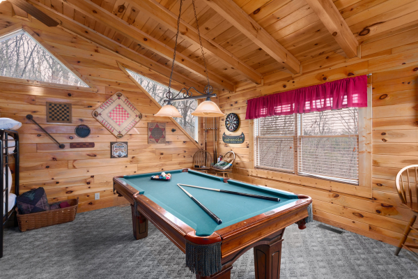 Pool table in the loft at Bootlegger's Bounty, a 1-bedroom cabin rental located in Pigeon Forge