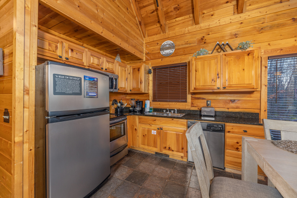 Kitchen with stainless steel appliances at A Bear on the Ridge, a 2 bedroom cabin rental located in Pigeon Forge