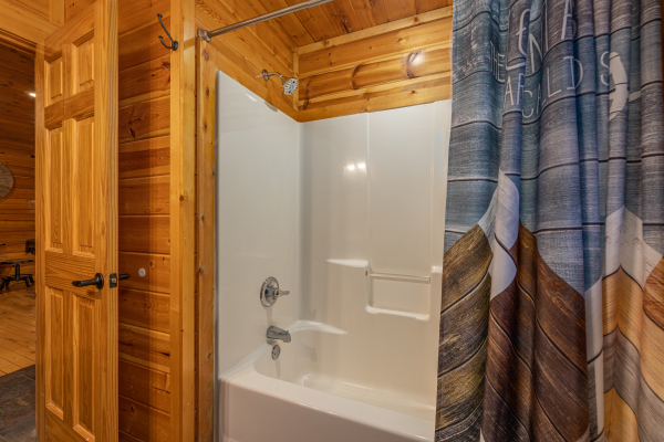 Tub and shower at A Bear on the Ridge, a 2 bedroom cabin rental located in Pigeon Forge